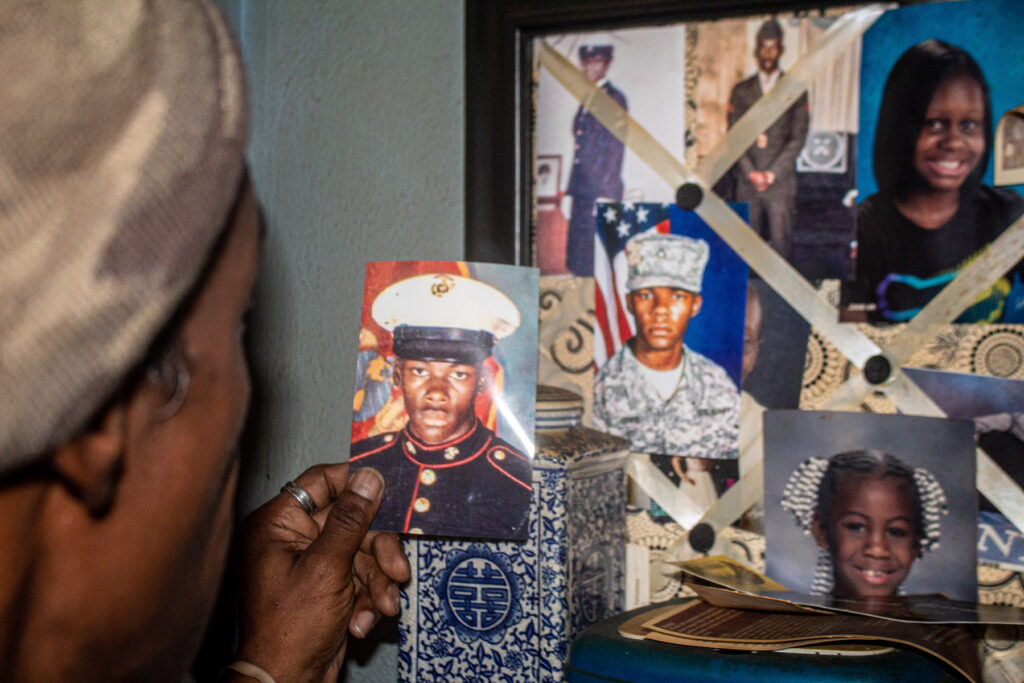 St. Louis client, Christopher, looking at pictures of himself in uniform